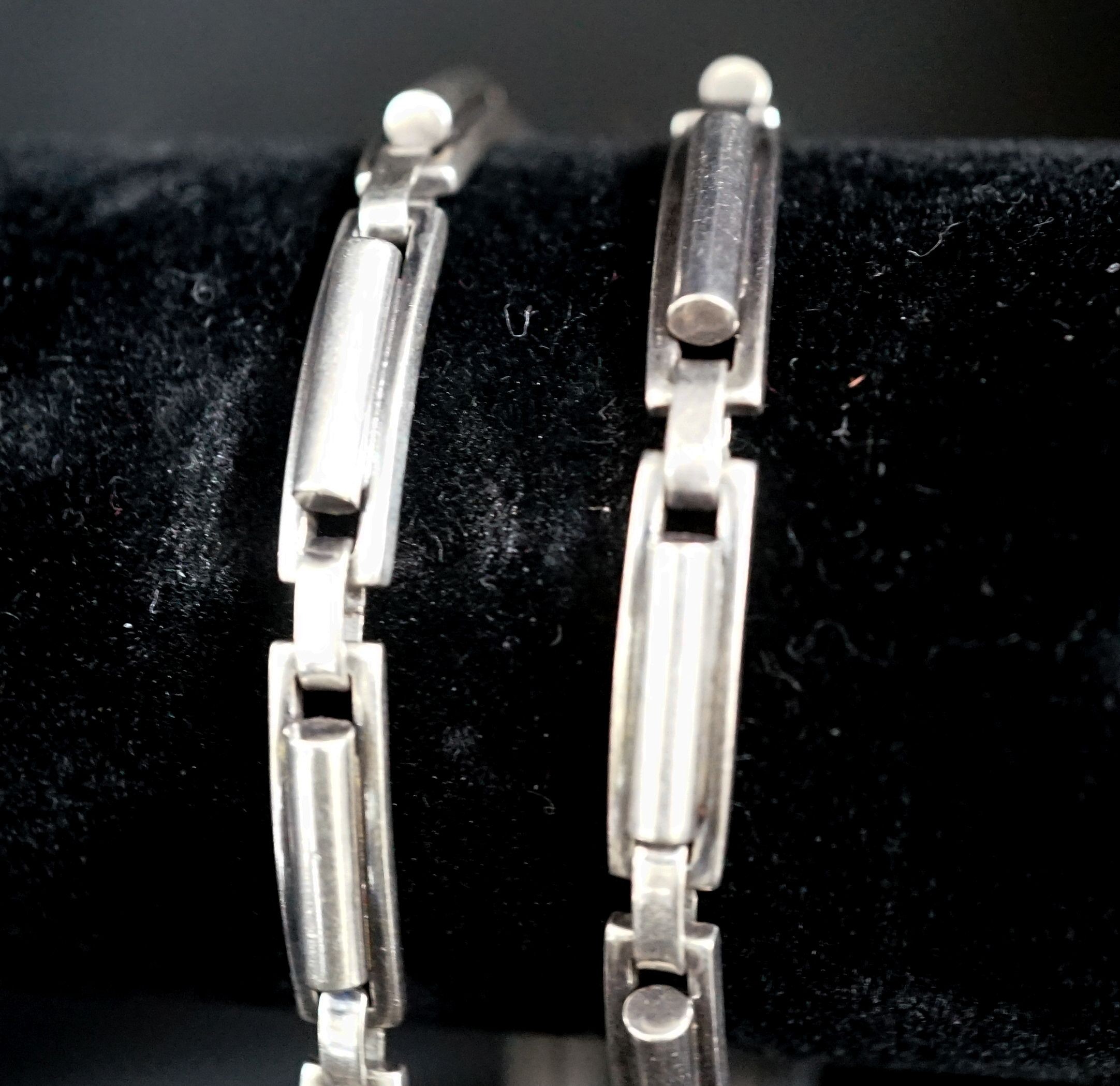 A Danish sterling 925 necklace, by Hans Hansen no 303, 38cm and a similar bracelet by Hans Hansen, no. 231, 18cm.